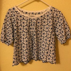 A laced shirt all around with flowers, worn once